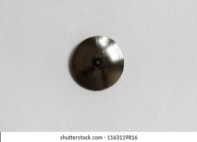 A Metal Thumb Tack Head Close Up  