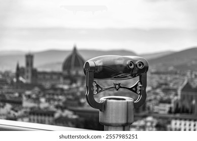 Metal tower viewer against the Cathedral Dome of Florence, Tuscany, Italy.