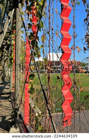 Metal trellis on the proscenium of the performance stage at Munro Martin Parklands intended to provide support for the growth of attached climbing vines. Cairns downtown area-Queensland-Australia.