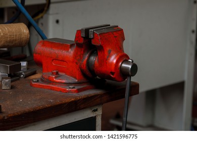 Metal Vice On Wooden Table