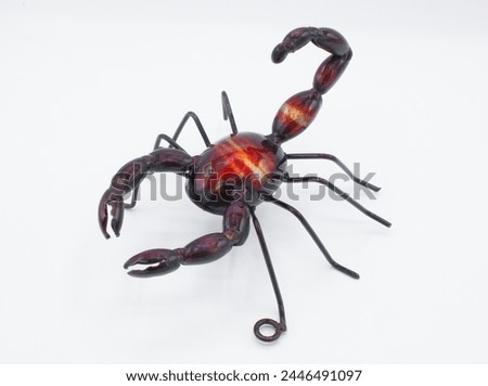 Metal wall art of a scorpion arachnid,  red, purple deep brown color with pinchers claws and tail up, isolated on white background. made for hanging up indoor or outdoor
