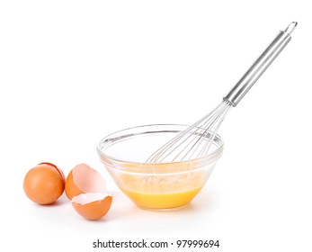 Metal whisk for whipping eggs and eggs in bowl isolated on white - Powered by Shutterstock