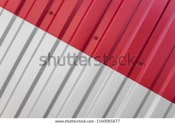 Metal white and red sheet for industrial\
building and construction. Roof sheet metal or corrugated roofs of\
factory building or\
warehouse.