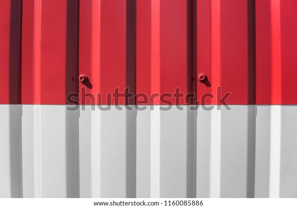 Metal white and red sheet for industrial\
building and construction. Roof sheet metal or corrugated roofs of\
factory building or\
warehouse.