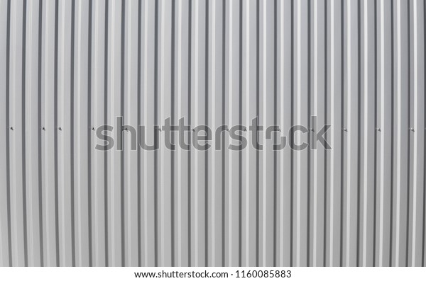 Metal white sheet for industrial building and\
construction. Roof sheet metal or corrugated roofs of factory\
building or warehouse.