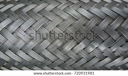Metal wire braiding. Steel texture. Background.
