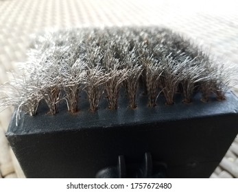 Metal Wire Brush To Clean Barbecue Grill On Table