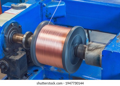 Metal Wire Spool Spins On The Machine.