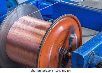 Metal Wire Spool Spins On The Machine.