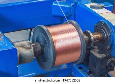 Metal Wire Spool Spins On The Machine.