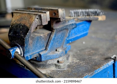 Metal Workbench With Viscle For Clamping Parts. View Of Workplace In Workshop. Order And Cleanliness In Workplace. Labor Protection. Background