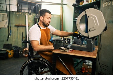 A metal worker in the wheelchair patiently and precisely cuts metal parts on a machine in his workshop. - Powered by Shutterstock