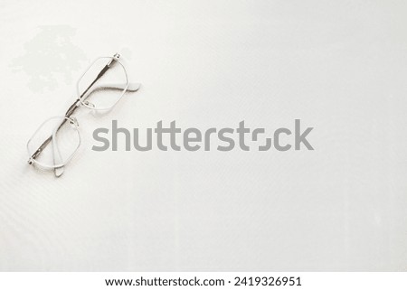  metal-framed glasses on a light background. free space for text. photo from above