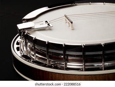 Metalic banjo isolated on black background