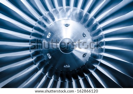 Metalic blue airplane engine vortex / turbofan