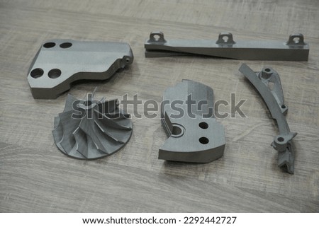 Metallic 3D printing, example of mechanical components of mechanical parts made with metallic 3D printing. Modern additive technology with laser and metallic powders, sintering.