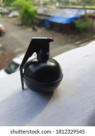 A Metallic Black Toy Hand Granade