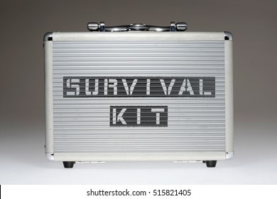 metallic box with survival kit phrase stencil print on it side