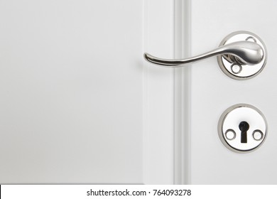 Metallic Classic Door Knob On A White Door. Open Closed