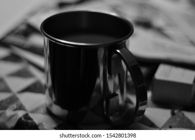 Metallic coffe mug in the morning
