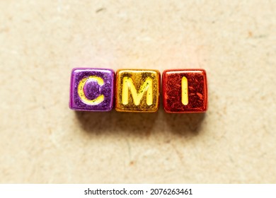 Metallic Color Alphabet Letter Block In Word CMI (Abbreviation Of Cost Management Index, Co-managed Inventory,Customer Managed Inventory Or Case Mix Index) On Wood Background