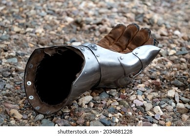 Metallic Gauntlet As Part Of Knight Equipment Abandoned On The Ground