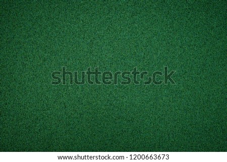 Metallic glitter green background, close up. Green paper backround. Green background from wrapping paper. 
