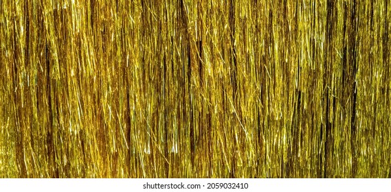 Metallic gold foil tinsel fringe decoration curtain. Birthday, wedding, Christmas, New Year party decoration background