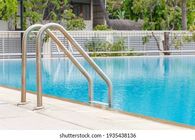Metallic ladder in swimming pool