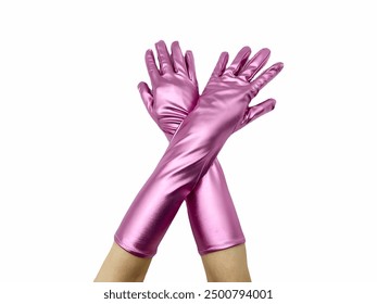 Metallic Pink Gloves shows a pair of person’s arms wearing shiny, pink, elbow-length gloves with hands crossed against a stark white background. - Powered by Shutterstock