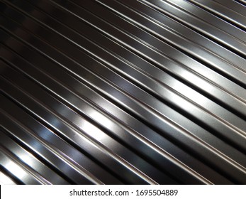 Metallic plate texture.Diagonal silver grey stripes wallpaper banner design.Corrugated metal plate background.