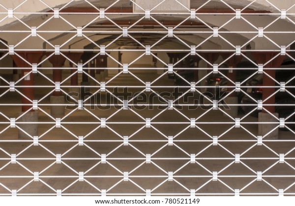 Metallic roll-up door for closing a parking\
garage as a pattern or\
texture