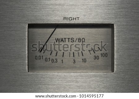 Metallic shell stereo system power indicator macro closeup