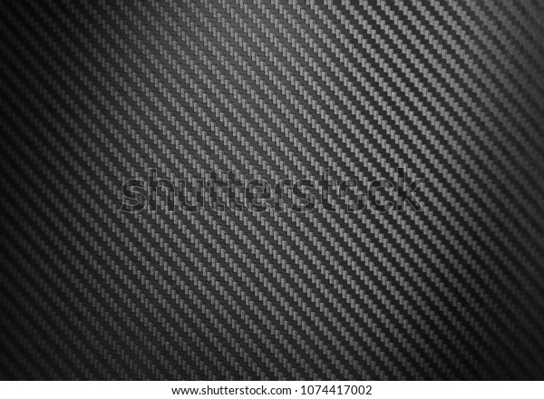 Metallic shiny texture of black\
carbon fiber self-adhesive paper. Material for racing car\
modification. Material design for background, wallpaper, graphic\
design
