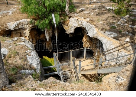 Metallic stairs leading down to the Stick-Tomato Cave through a sinkhole in the Naracoorte Caves National Park in South Australia