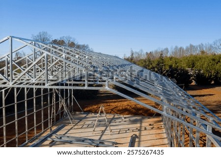 Metallic structure is taking shape as construction progresses in metal framed warehouse
