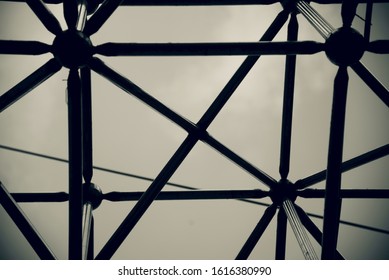 Metallic structures with sky background black and white photo