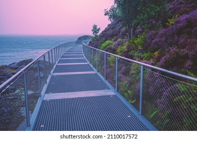 Metallic walkway along sea and mount in autumn. Norway, Europe - Powered by Shutterstock