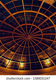 Metallic yellowish round shape structures of an interior ceiling