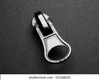 Metallic Zipper Pull On Grey Background (black & White)