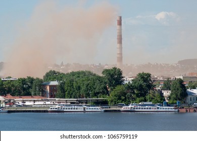 Metallurgical Plant Near A Beautiful Lake. Emission Of Nitrogen Oxide Into The Atmosphere. Pollution Of The Environment.