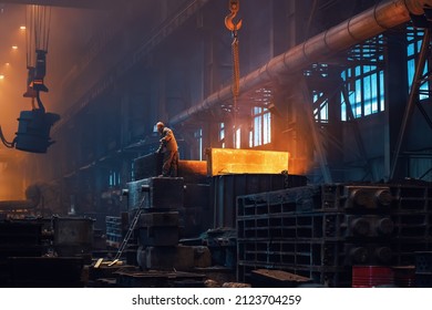 Metallurgy Plant Interior. Foundry Worker On Big Mold For Iron Cast. Heavy Industry. Steel Factory