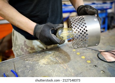 Metalwork Craftsman Making Handmade Lamp At Workshop. Man Worker Screws Up The Parts Of Lampshade. Do It Yourself. Small Local Business.