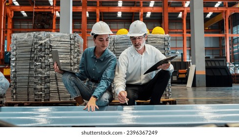 Metalwork manufacturing factory manager inspect newly manufactured metal or steel sheets and frame in factory. Inspection and quality control process ensure highest quality. Panorama Exemplifying - Shutterstock ID 2396367249