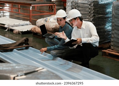 Metalwork manufacturing factory manager inspect newly manufactured metal or steel sheets and frame in factory. Inspection and quality control process ensure highest quality product. Exemplifying - Shutterstock ID 2396367295