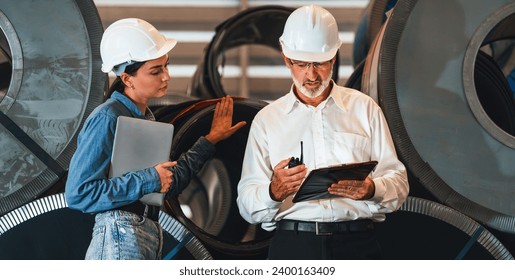 Metalwork manufacturing factory manager inspect newly manufactured metal or steel roll and frame in factory. Inspection and quality control process ensure highest quality product. Exemplifying - Powered by Shutterstock