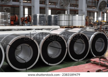 Metalwork manufacturing, warehouse of raw materials. Rolls of metal sheet in aluminum material warehouse