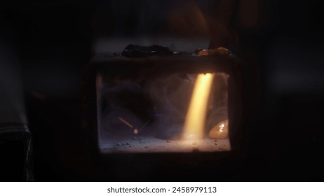 Metalworker using welding machine on iron surface, flame, sparks and flashing lights, close up view of welding steel material. Close up shot.