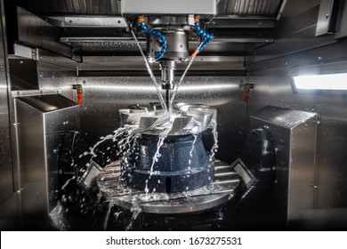 Metalworking CNC lathe milling machine. Cutting metal modern processing technology. Milling is the process of machining using rotary cutters to remove material by advancing a cutter into a workpiece. - Powered by Shutterstock