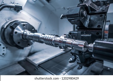 Metalworking CNC milling machine. Cutting metal modern processing technology. Small depth of field. Warning - authentic shooting in challenging conditions. A little bit grain and maybe blurred. - Powered by Shutterstock